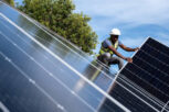 An African Engineer installing solar panels on the roof of a residential house in Cape Town, South Africa. Alternative energy solutions are critical during load shedding in South Africa